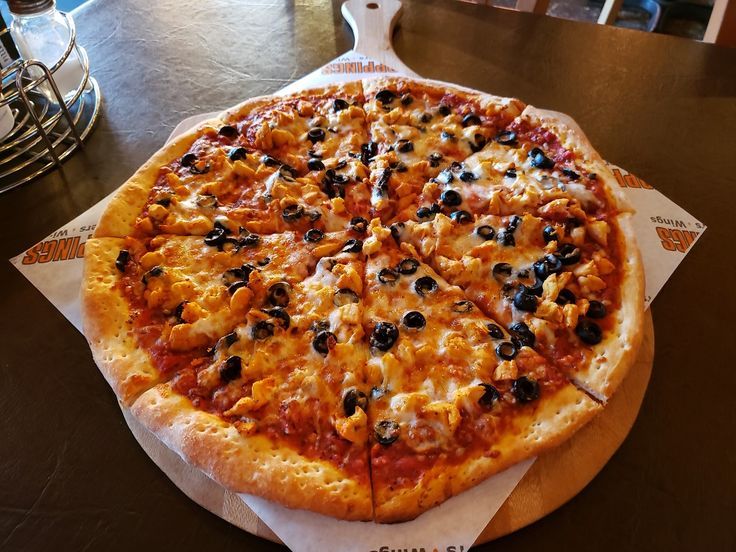 A freshly baked pizza with melted cheese and toppings, representing a blog about halal-certified pizzas and fusion flavors offered by the restaurant.